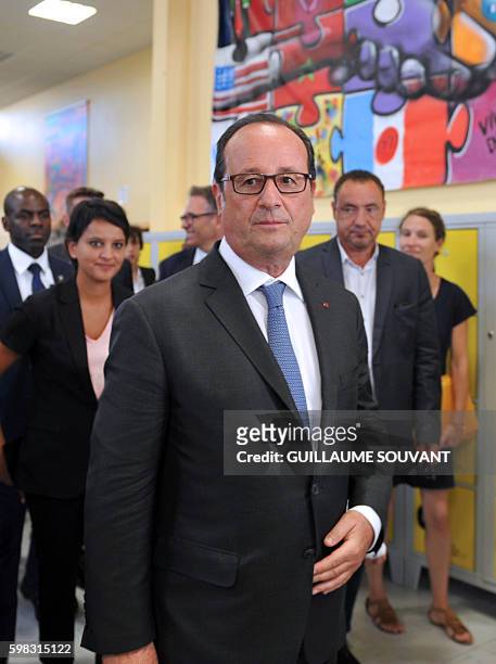 French President Francois Hollande leaves the secondary school Jean Rostand after his visit for the first day of the starting of the school year in...