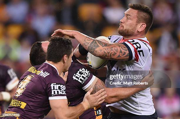 Jared Waerea-Hargreaves of the Roosters is tackled during the round 26 NRL match between the Brisbane Broncos and the Sydney Roosters at Suncorp...