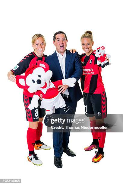 Juliane Maier and Selina Wagner of SC Freiburg pose with Michael Sehringer of Allianz during the Allianz Women's Bundesliga Club Tour on August 31,...