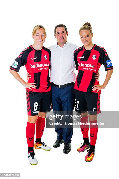 Juliane Maier and Selina Wagner of SC Freiburg pose with Michael Sehringer of Allianz during the Allianz Women's Bundesliga Club Tour on August 31,...