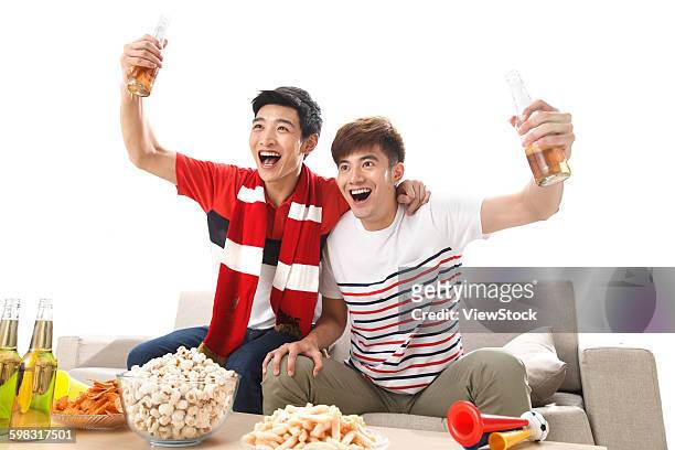 young fans watching the game cheering  - china fans cheer stock pictures, royalty-free photos & images