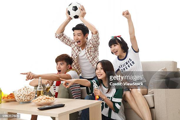 young fans watching the game cheering  - china fans cheer stock pictures, royalty-free photos & images