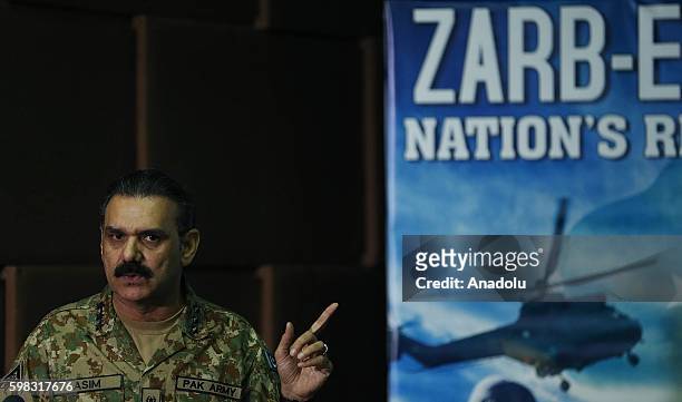 Pakistani Army Spokesman Lieutenant General Asim Saleem Bajwa holds a press conference at the Building Inter Services Public Relations in Rawalpindi,...
