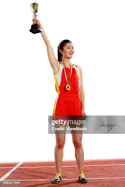 women athletes win medals and trophies - the asian awards 2015 fotografías e imágenes de stock