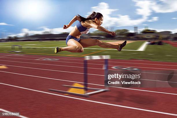 track and field athletes in hurdle race - china athlete woman stock pictures, royalty-free photos & images