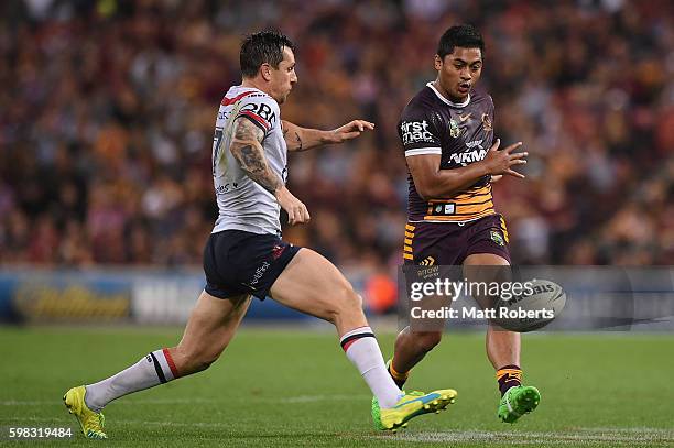 Anthony Milford of the Broncos kicks the ball during the round 26 NRL match between the Brisbane Broncos and the Sydney Roosters at Suncorp Stadium...