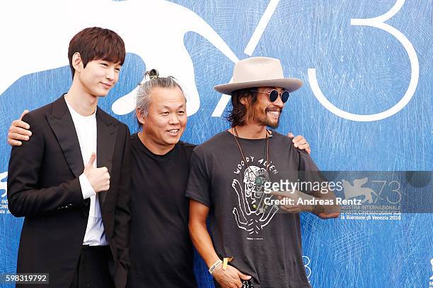 Actor Lee Won-gun, director Kim Ki-duk and actor Ryoo Seung-Bum attend a photocall for 'Geumul - The Net' during the 73rd Venice Film Festival at on...