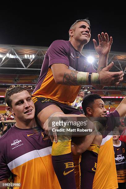 Corey Parker of the Broncos is chaired off the field during the round 26 NRL match between the Brisbane Broncos and the Sydney Roosters at Suncorp...