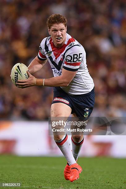 Dylan Napa of the Roosters runs with the ball during the round 26 NRL match between the Brisbane Broncos and the Sydney Roosters at Suncorp Stadium...