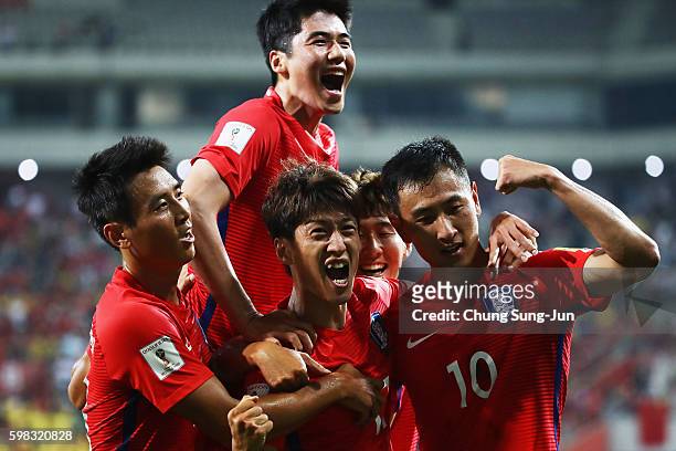 Lee Chung-yong of South Korea celebrates scoring his team's second goal with his team mates during the 2018 FIFA World Cup Qualifier Final Round...