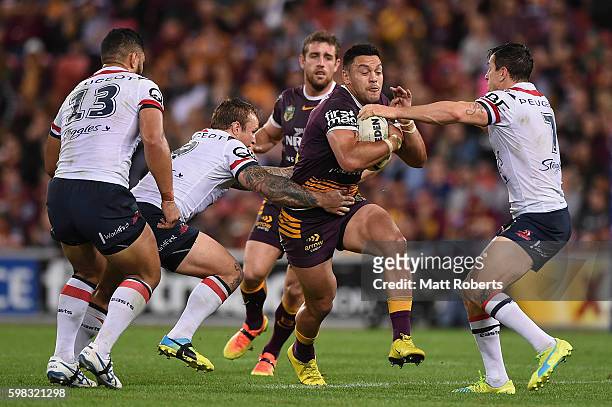 Alex Glenn of the Broncos runs with the ball during the round 26 NRL match between the Brisbane Broncos and the Sydney Roosters at Suncorp Stadium on...