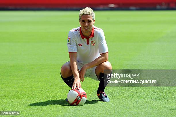 Sevilla's new French player Samir Nasri poses on the pitch, during his official presentation at the Ramon Sanchez Pizjuan stadium in Sevilla on...