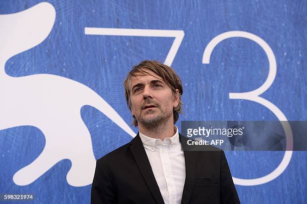 Actor Jens Harzer poses during a photocall of the movie "Les Beaux Jours d'Aranjuez" presented in competition at the 73rd Venice Film Festival on...