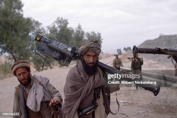 Portrait of unidentified Afghani mujahideen , with a US-made Stinger missile launcher, on a road during the battle for Jalalabad, Afghanistan, March...