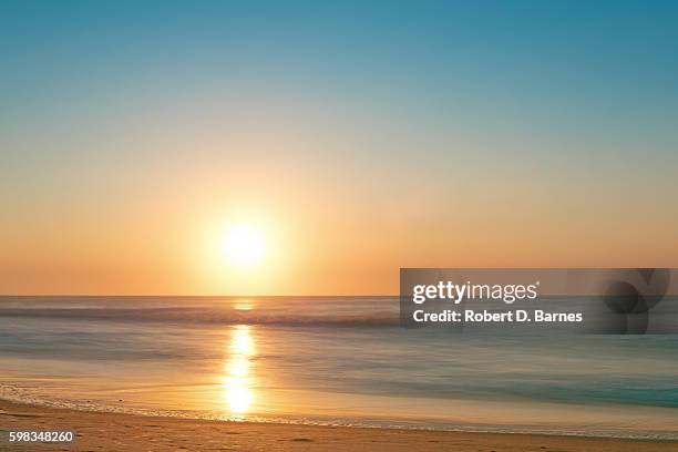 sunrise on the beach - aurora foto e immagini stock