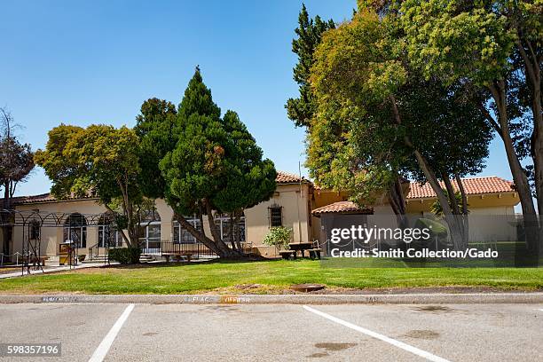 Spanish Colonial Revival style buildings with trees within the secure area of the NASA Ames Research Center campus in the Silicon Valley town of...