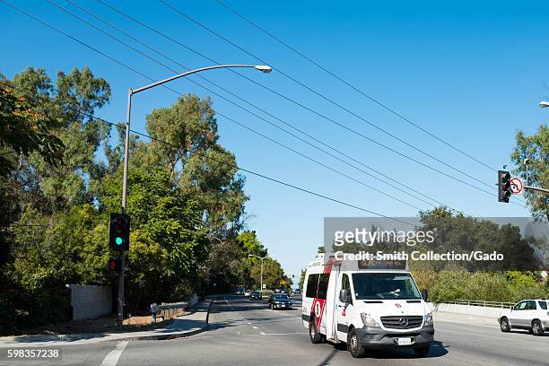 Shuttle bus for the SLAC National Accelerator Laboratory travels down Sand Hill Road in the Silicon Valley town of Menlo Park, California, August 25,...