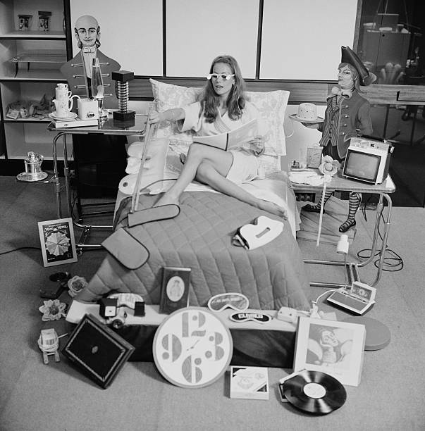 French actress Claudine Auger surrounded by objects sold in The Gadgeterie, the Paris boutique owned by Marianne Frey, Paris, France, 3rd October...