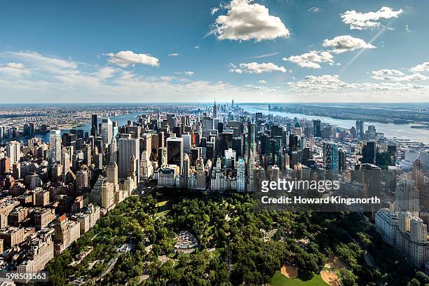 aerial of nyc over central park - aerial new york fotografías e imágenes de stock