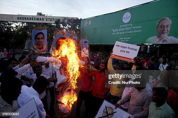 Activists of the Bharatiya Janata Party burnt the effigy of eastern Indian state Odishas chief minister Naveen Patnaik and his four corrupted MLAs...