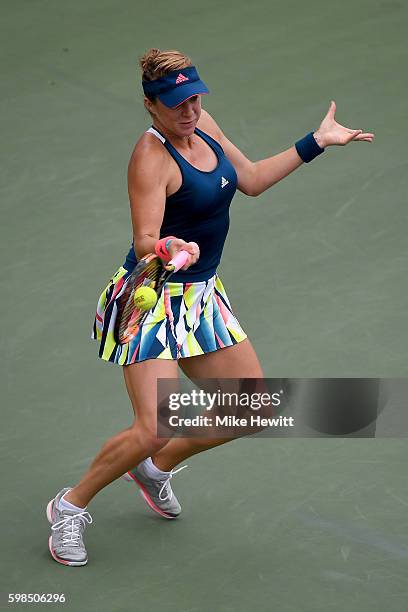 Anastasia Pavlyuchenkova of Russia returns a shot toKristina Mladenovic of France during her second round Women's Singles match on Day Four of the...