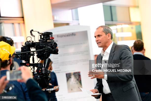 Franceinfo's French journalist Louis Laforge speaks in front of a camera, on September 1 prior to the launch of the new public news channel...