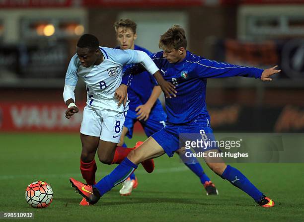 Dennis Adeniran of England U18 is tackled by Matteo Gabbia of Italy U18 during the international friendly match between England U18 and Italy U18 at...