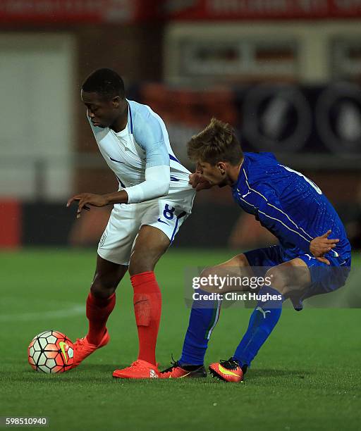 Dennis Adeniran of England U18 is tackled by Matteo Gabbia of Italy U18 during the international friendly match between England U18 and Italy U18 at...