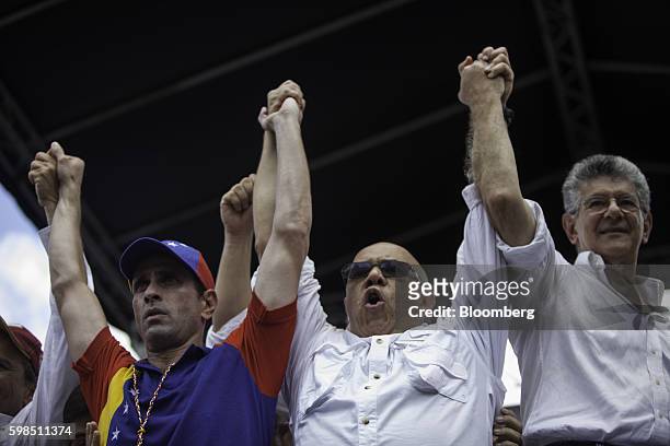 Henrique Capriles, opposition leader and two-time presidential candidate, left, Jesus Torrealba, secretary-general of the opposition coalition,...
