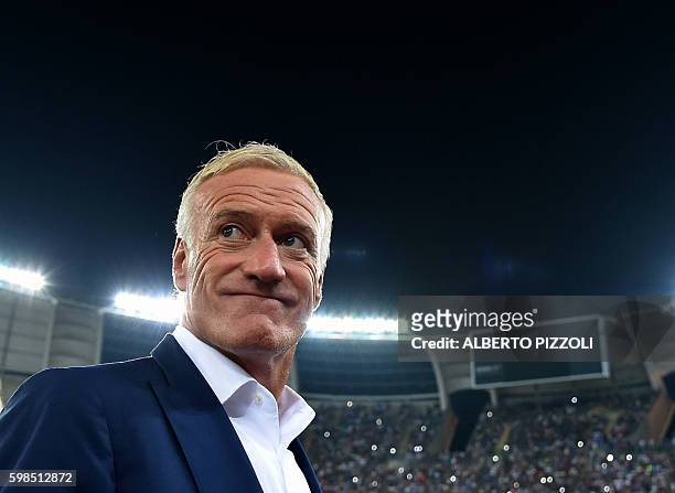 France's coach Didier Deschamps smiles as he arrives for the friendly football match Italy vs France on September 1, 2016 at San Nicola stadium in...