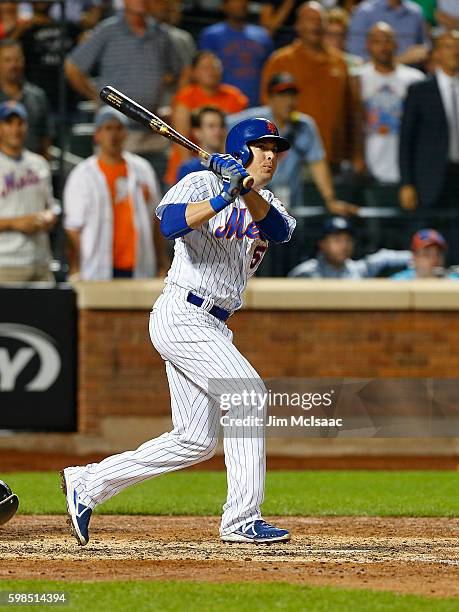 Kelly Johnson of the New York Mets follows through on an eighth inning three run double against the Miami Marlins at Citi Field on August 31, 2016 in...