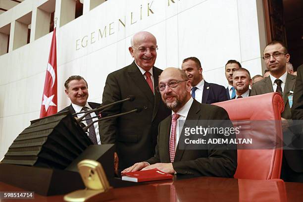 President of the European Parliament Martin Schulz seats next to Speaker of the Turkish Grand National Assembly Ismail Kahraman during his visit of...