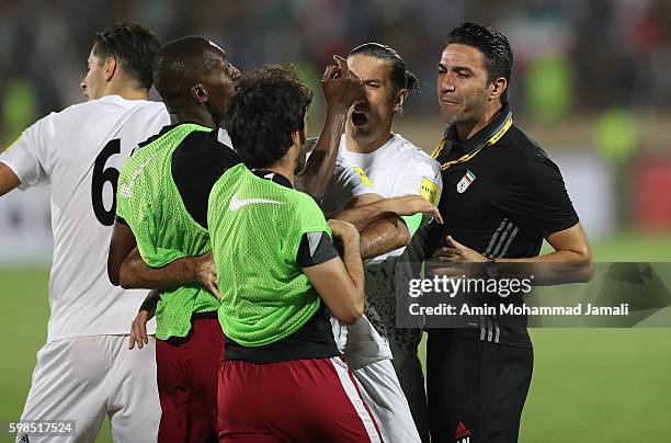 Iranian coach Javad Nekounam and Qatar's Players in fight during FIFA 2018 World Cup Qualifier match between Iran against Qatar on September 1, 2016...