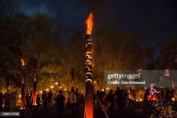 Installations are lit in front of Tate Modern as part of the 'Fire Garden' event by Compagnie Carabosse on September 1, 2016 in London, England. The...