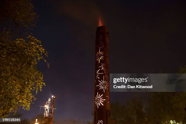 Installations are lit in front of Tate Modern as part of the 'Fire Garden' event by Compagnie Carabosse on September 1, 2016 in London, England. The...