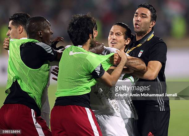 Iranian coach Javad Nekounam and Qatar's Players in fight during FIFA 2018 World Cup Qualifier match between Iran against Qatar on September 1, 2016...