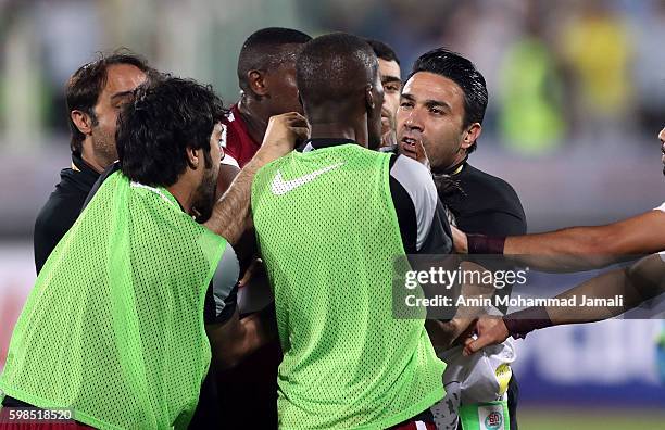 Iranian coach Javad Nekounam and Qatar's Players in fight during FIFA 2018 World Cup Qualifier match between Iran against Qatar on September 1, 2016...