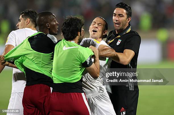 Iranian coach Javad Nekounam and Qatar's Players in fight during FIFA 2018 World Cup Qualifier match between Iran against Qatar on September 1, 2016...