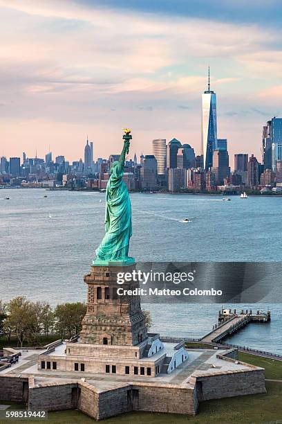 aerial of the statue of liberty at sunset, new york, usa - statue of liberty new york city - fotografias e filmes do acervo