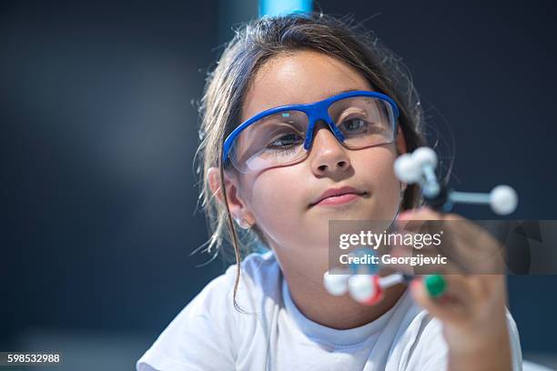 looking at molecular structure model. - professional childrens school stock pictures, royalty-free photos & images