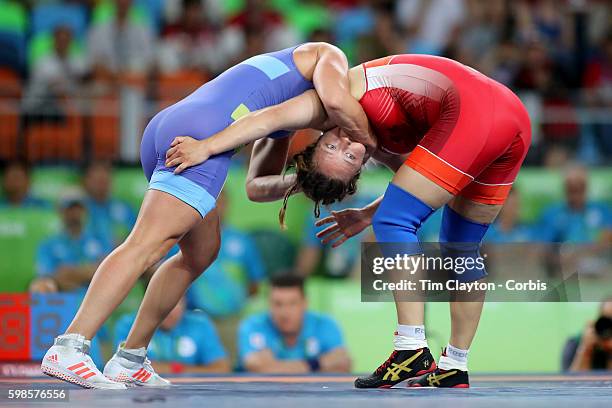 Day 12 Anna Jenny Fransson of Sweden holds Dorothy Erzsebet Yeats, , of Canada during their Women's Freestyle 69 kg Bronze Medal Final at the Carioca...