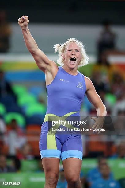 Day 12 Anna Jenny Fransson of Sweden celebrates victory over Dorothy Erzsebet Yeats of Canada during their Women's Freestyle 69 kg Bronze Medal Final...