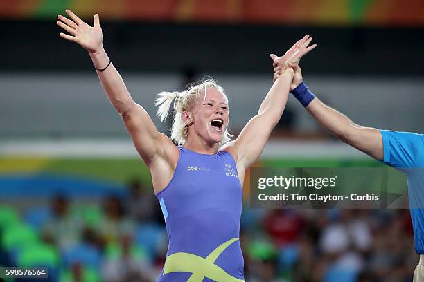 Day 12 Anna Jenny Fransson of Sweden celebrates victory over Dorothy Erzsebet Yeats of Canada during their Women's Freestyle 69 kg Bronze Medal Final...