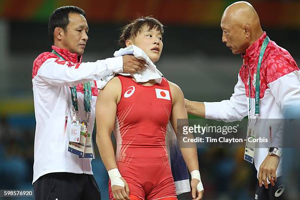 Day 12 Eri Tosaka of Japan with her coach Kazuhito Sakae during the Women's Freestyle 48 kg contest against against Zhuldyz Eshimova of Kazakhstan at...