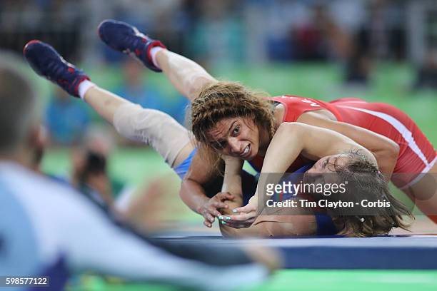Day 12 Marwa Amri of Tunisia "nin action against Yuliya Ratkevich of Azerbaijan during their Women's Freestyle 58 kg Bronze Medal Final at the...