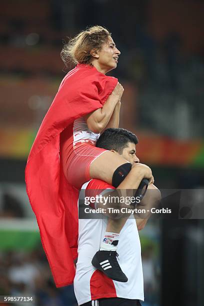 Day 12 Marwa Amri of Tunisia "ncelebrates victory against Yuliya Ratkevich of Azerbaijan during their Women's Freestyle 58 kg Bronze Medal Final at...