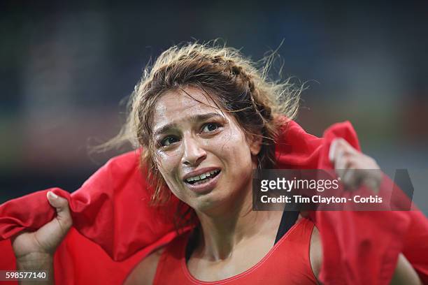 Day 12 Marwa Amri of Tunisia "ncelebrates victory against Yuliya Ratkevich of Azerbaijan during their Women's Freestyle 58 kg Bronze Medal Final at...