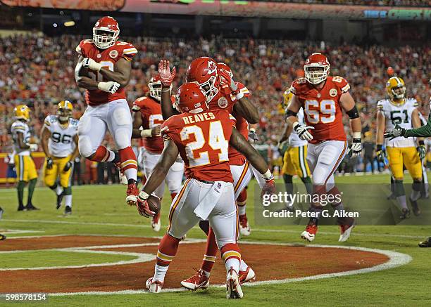 Running back D.J. White of the Kansas City Chiefs celebrates with his teammates after scoring a touchdown against the Green Bay Packers during the...