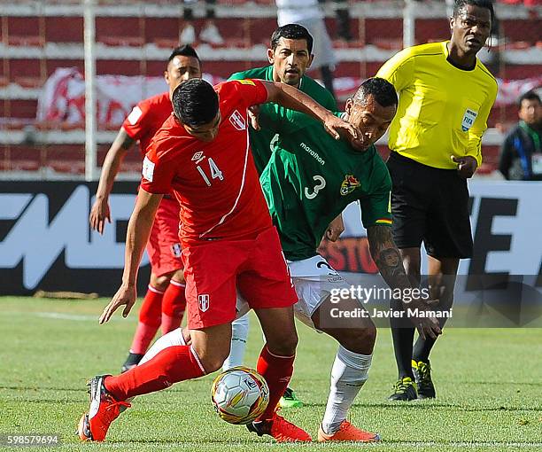 Edemir Rodriguez of Bolivia fights for the ball with Irven Avila of Peru during a match between Bolivia and Peru as part of FIFA 2018 World Cup...