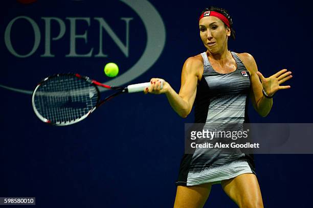 Jelena Jankovic of Serbia returns a shot to Carla Suarez Navarro of Spain during her second round Women's Singles match on Day Four of the 2016 US...
